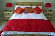 Main bedroom with designer bedding and goose down duvets